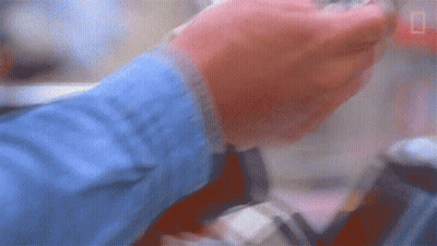 Blurry Person's Hands Holding Something GIF