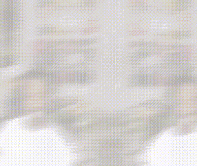 Blurry Person Sitting In Front Of Poster Wall GIF