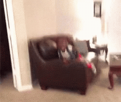 Blurry Person Sitting On Couch GIF