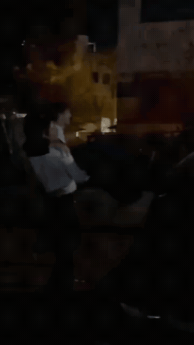 Blurry Person Standing In Dark GIF