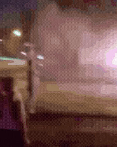 Blurry Person Standing In Front Of Light GIF
