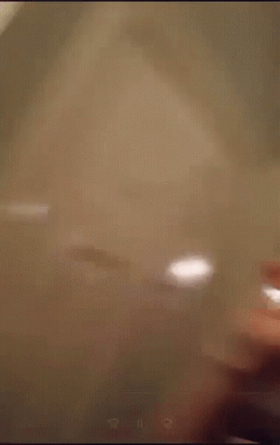 Blurry Person Standing In Front Of Microwave Oven GIF