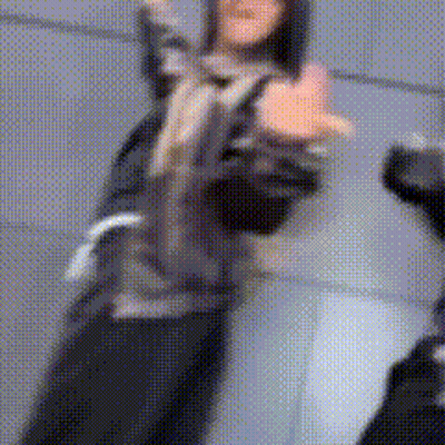 Blurry Person Standing In Front Of Wall GIF