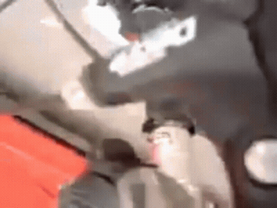 Blurry Person Standing On Red Surface GIF