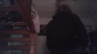 Blurry Person Standing On Staircase GIF