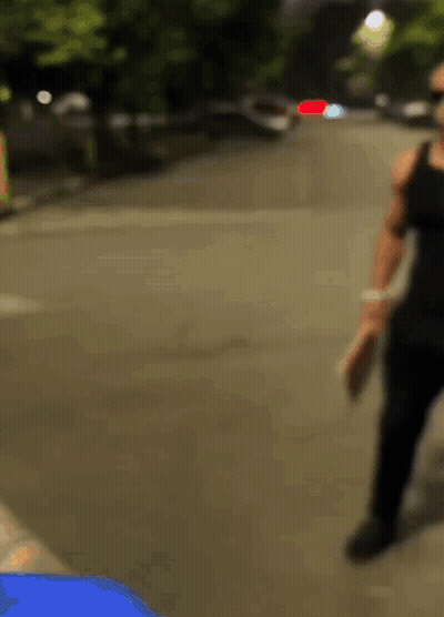Blurry Person Walking Down Street GIF