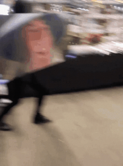Blurry Person Walking Down Street GIF