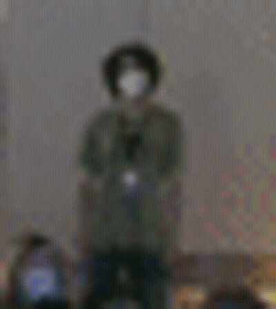 Blurry Person Wearing Mask And Headphones GIF