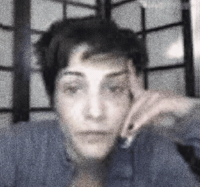 Blurry Person With Hand On Face GIF