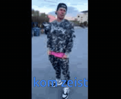 Blurry Person With Kom Zeist In Blue Letters GIF