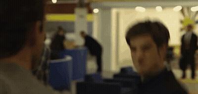 Blurry Picture Of Two Men Standing In A Room GIF