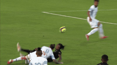 Blurry Soccer Field With Coca Cola Sign GIF