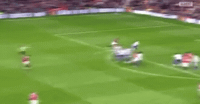 Blurry Soccer Game Players In Red GIF