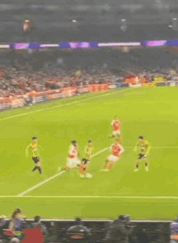Blurry Soccer Game With Yellow Flag GIF