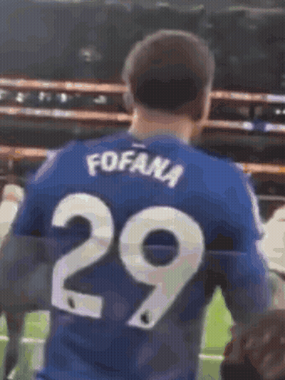 Blurry Soccer Game With Yellow Sign GIF