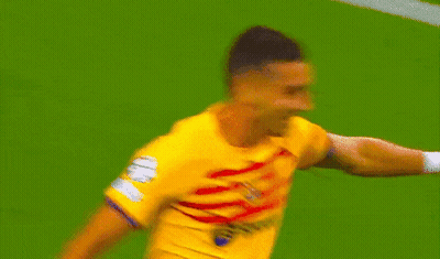 Blurry Soccer Player In Yellow GIF