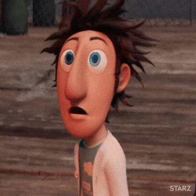 Blurry Street With Cars And Buildings GIF