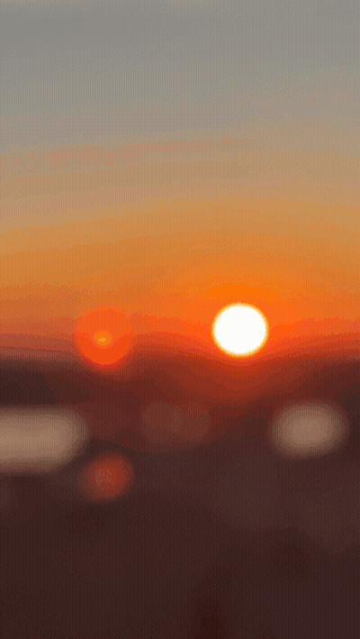 Blurry Sunset With Sun In Center GIF