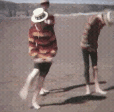 Blurry Two People Dancing On Beach GIF