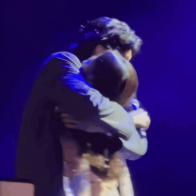Blurry Two People Hugging Blue Background GIF