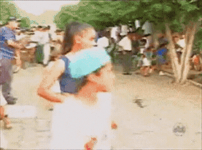 Blurry Woman Carrying Child On Back GIF