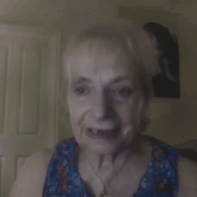 Blurry Woman Face With Man In Background GIF