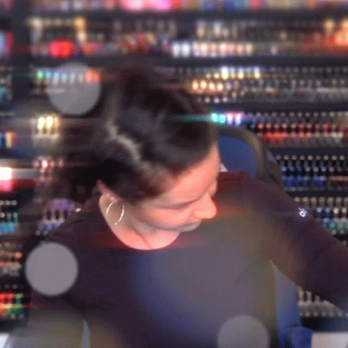 Blurry Woman In Black Shirt With Word Champion GIF