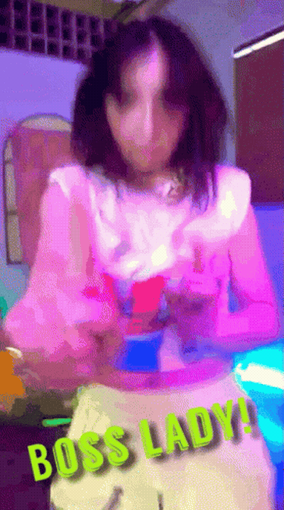 Blurry Woman In Pink Top Saying Boss Lady GIF
