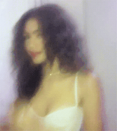 Blurry Woman In White Bra And Necklace GIF