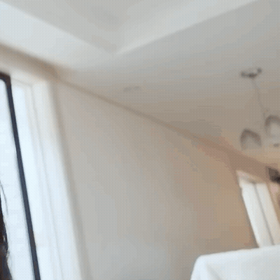 Blurry Woman In White Sweatshirt Saying Aunt GIF
