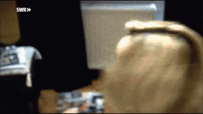 Blurry Woman Looking At Computer Screen SWR GIF