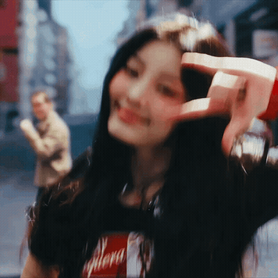Blurry Woman Making Peace Sign GIF