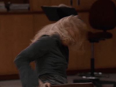 Blurry Woman Sitting In Office Chair GIF