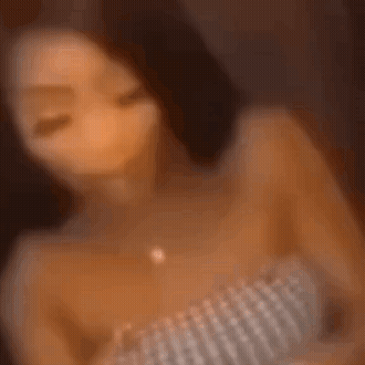 Blurry Woman Wearing Necklace And Watch GIF
