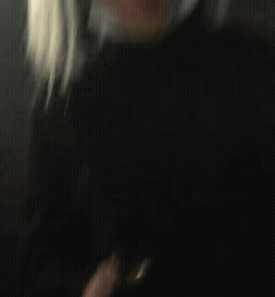 Blurry Woman With Long Blonde Hair GIF