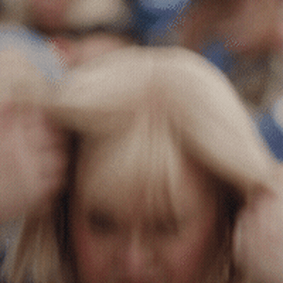 Blurry Woman With Man's Arm Behind Her GIF
