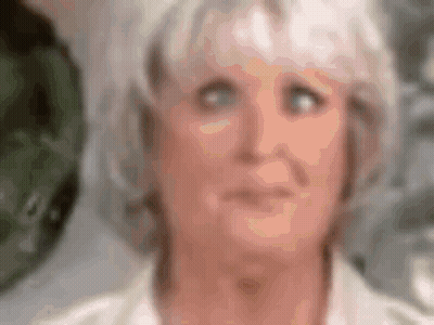 Blurry Woman With White Hair And Blue Eyes GIF