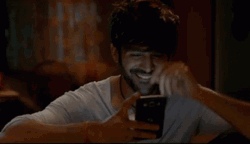 Blushing Guy Timid Texting GIF