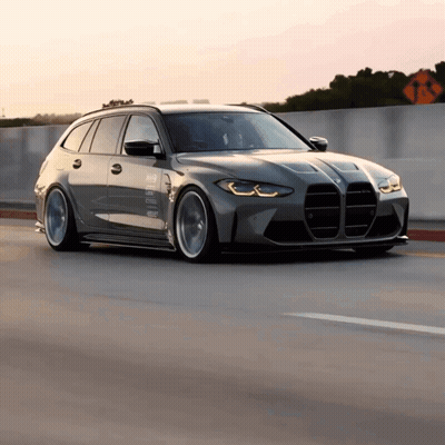 BMW Driving Down Highway With No Left Turns Sign