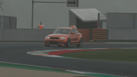 Bmw M Series Driving Along Race Track GIF