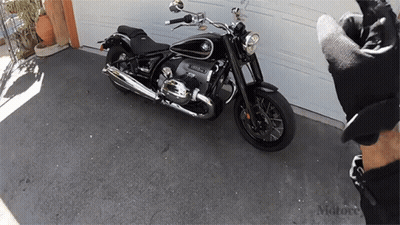 BMW Motorcycle Parked In Front Of Garage GIF