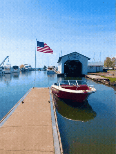 Boat Tied To Dock By Propeller Works Shed GIF
