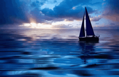 Boat With Blue Sails At Sunset GIF