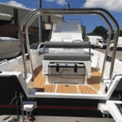Boat With Cooler On Deck In Parking Lot GIF