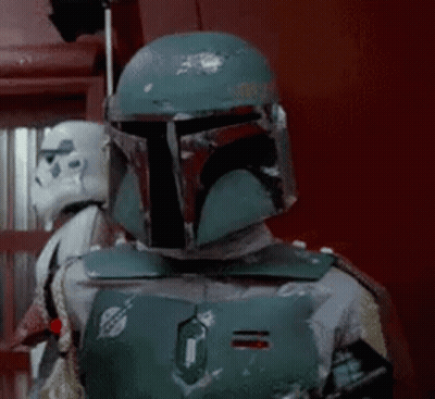 Boba Fett Is Wearing A Helmet And Standing Next To A Storm Trooper In A Room . GIF