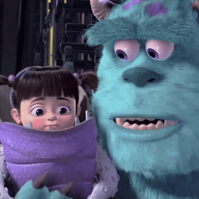 Boo And Sulley From Monsters Inc Are Standing Next To Each Other GIF