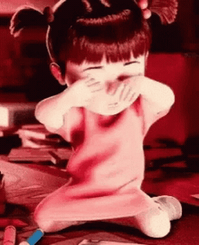 Boo From Monsters Inc Is Covering Her Mouth With Her Hands GIF