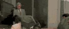 Boss Watching Men Carrying Money Bags GIF