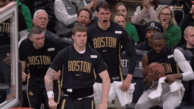 Boston Basketball Players Cheering In Front Of Crowd GIF