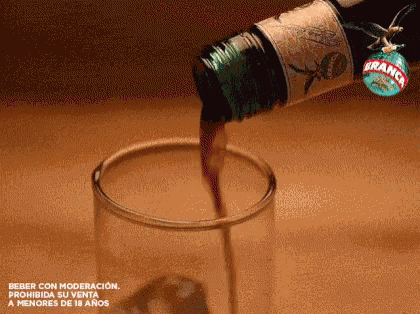 Bottle Of Branco Pouring Into Glass GIF